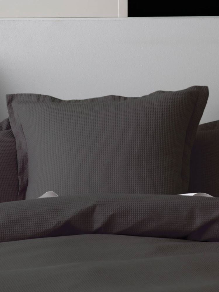 Californian King Duvet Cover Set Nova in charcoal, featuring cotton waffle front and percale reverse with tailored flange.