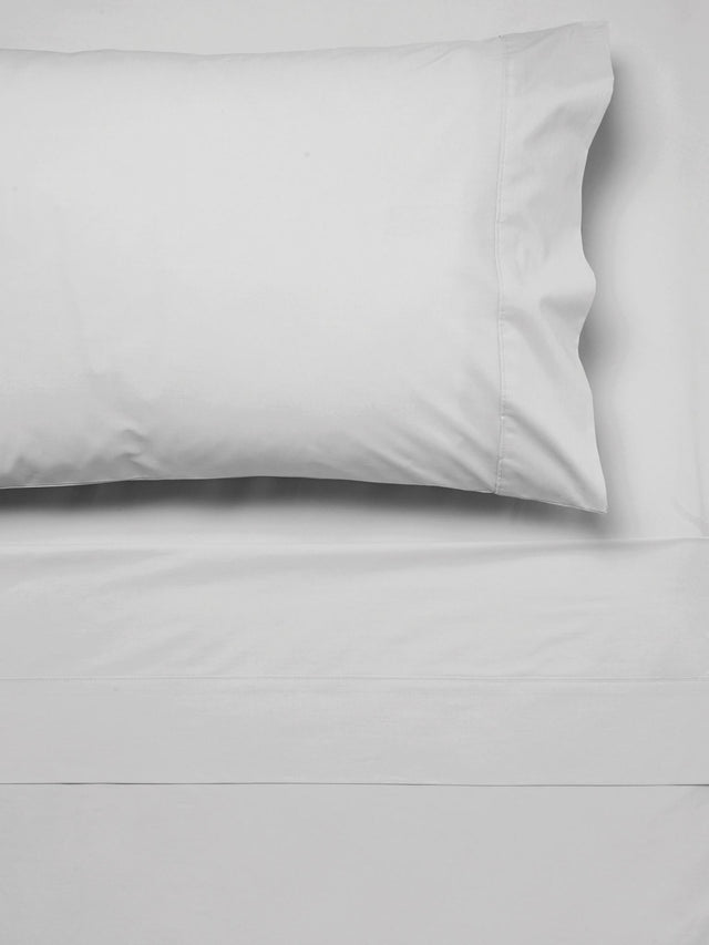 Luxurious Savona SILVER single sheet set in 300T cotton, featuring cuffed flat and piped pillowcase for a modern bedroom upgrade.