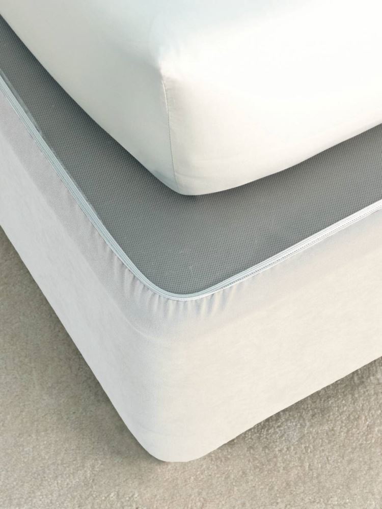 Chic white faux suede bedwrap for single beds, providing a contemporary look and snug fit without removing linens.