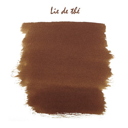 Herbin Writing Ink 10ml Lie de The in a bottle, featuring rich tea brown color for fountain pens and artistic use.