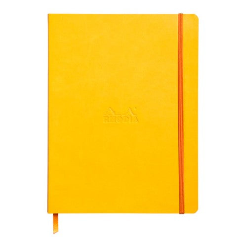 Vibrant daffodil softcover notebook B5 with dotted pages, orange elastic closure, and premium ivory paper.