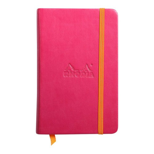 Rhodiarama pocket notebook in vibrant raspberry, featuring 192 lined pages and a luxurious Italian leatherette cover.