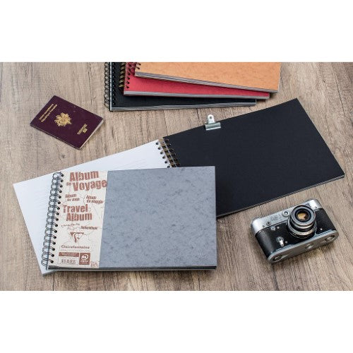 A4 red travel album by Clairefontaine featuring 40 pages of lined and black photo paper for documenting adventures.