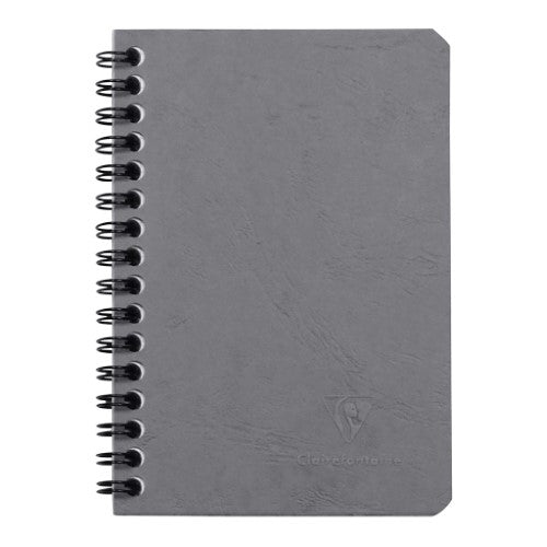 Pocket-sized grey spiral notebook with 100 lined pages and durable pressboard cover, ideal for travel and journaling.