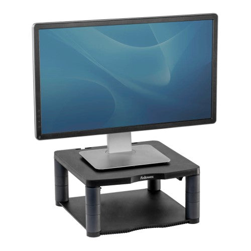 Fellowes Premium Monitor Riser elevates monitors for ergonomic comfort and doubles as a paper storage shelf, made from recycled plastic.