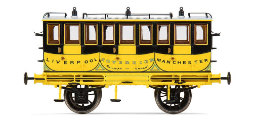 Model of the LM&R 1st Class Coach Sovereign in yellow, resembling a luxury horse-drawn carriage from the 19th century.