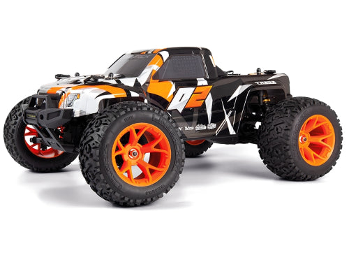 Vibrant orange 1/10 Quantum2 MT RC truck with bright wheels, lights, and robust design for durable off-road performance.