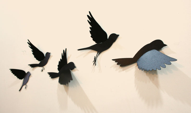 Wall art featuring five colorful polypropylene sparrows in flight, perfect for adding charm and personality to any room.
