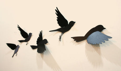 Wall art featuring five colorful polypropylene sparrows in flight, perfect for adding charm and personality to any room.