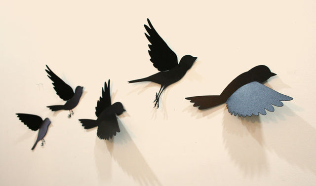 Wall art featuring five colorful polypropylene sparrows in flight, perfect for adding charm and personality to any room.