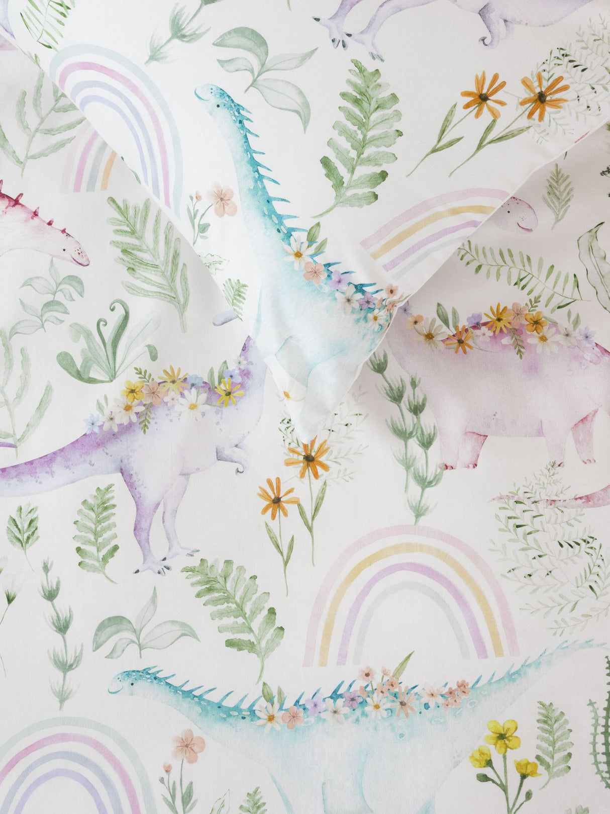 Dino Garden Duvet Cover Set featuring pastel dinosaurs and blossoms, made from soft 100% cotton, perfect for kids' rooms.