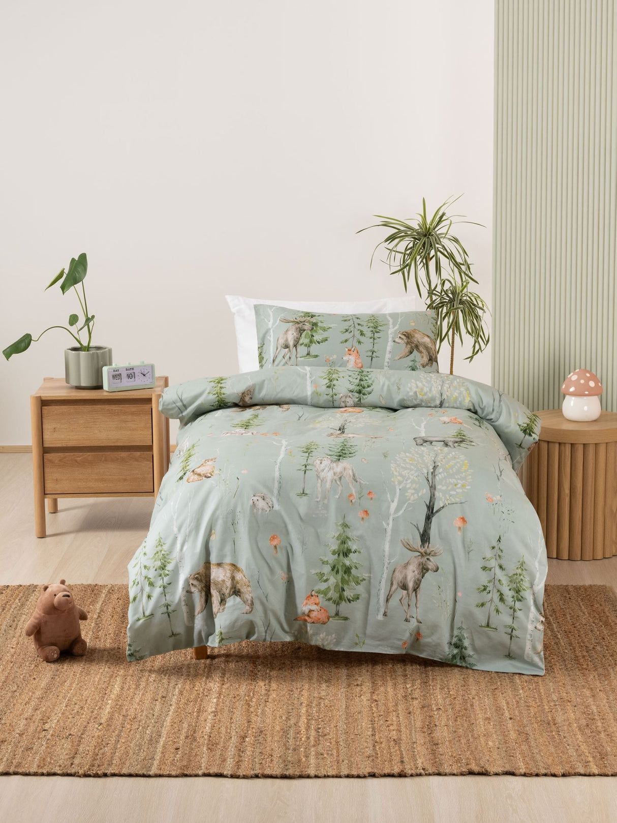 Single duvet cover set featuring enchanting animals on a sage green background, designed for a cozy child's bedroom.