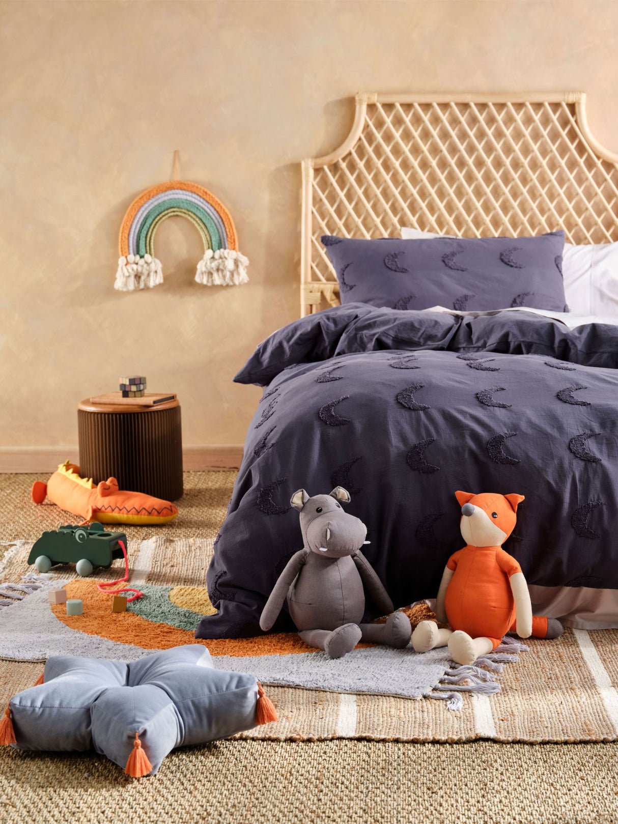 Single duvet cover set featuring tufted moons on navy, made from soft 100% cotton for cozy kids' bedding.
