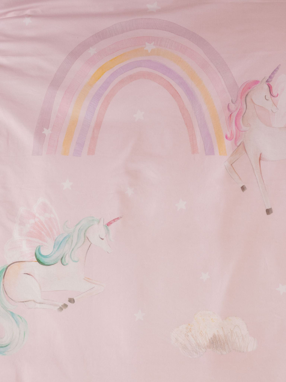 Single duvet cover set featuring whimsical unicorns, rainbows, and clouds on a soft pink background, crafted from 100% cotton.