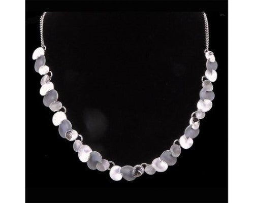 Rhodium plated silver necklace featuring delicate lilypad design, 46cm length with adjustable extension for elegance.