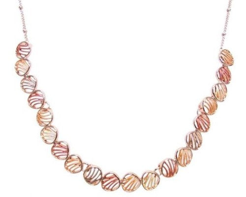 Elegant rose gold necklace featuring delicate leaf designs, perfect for versatile styling and any occasion.