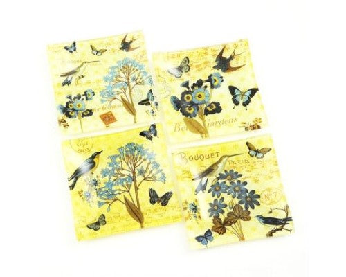 Set of four floral-themed glass plates, 15 cm square, perfect for serving snacks or organizing small items.