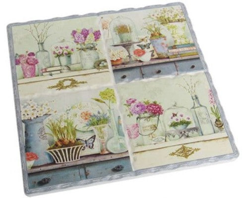 Cork-backed ceramic trivet featuring a charming French design, measuring 15.5 cm x 16 cm for protecting surfaces.