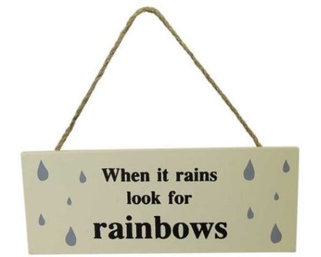 MDF wall art sign with rope hanger featuring 'When it rains, look for rainbows' quote, measuring 18 x 7 cm.