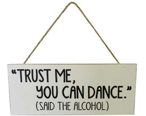 Whimsical MDF wall art with the quote 'Trust me, you can dance (said the alcohol)' and rustic rope hanger.