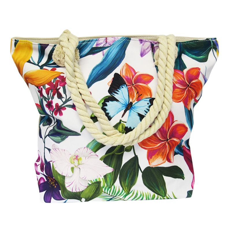 Vibrant frangipani print rope tote bag with zipped compartments, perfect for beach, shopping, or errands.