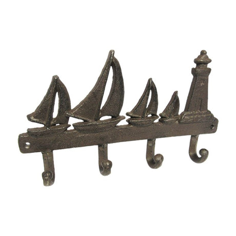 Cast iron sailboat hanger, 28cm tall, adds nautical charm while providing sturdy support for coats and bags.