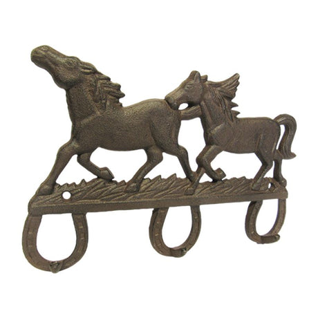 Rustic cast iron triple hook featuring two majestic horses, perfect for organizing coats and bags while enhancing decor.