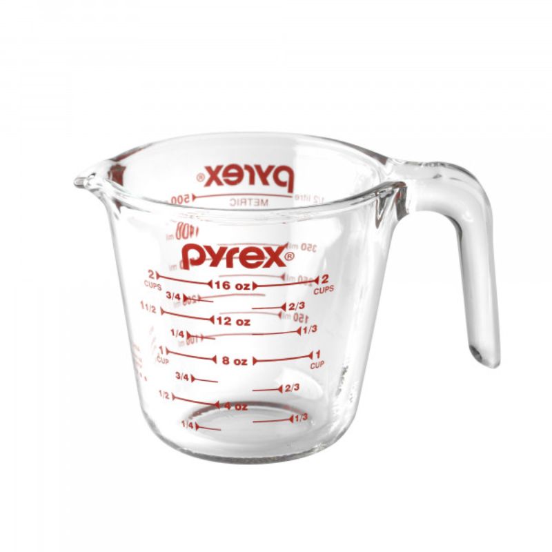 Pyrex 2 Cup Measuring Jug in tempered glass with vibrant red measurements for precision, ergonomic handle, and spout for easy pouring.