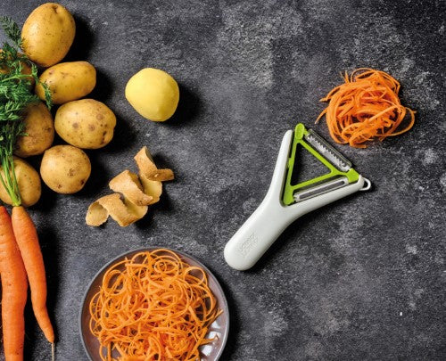 Joseph Joseph Switch 2in1 Peeler with straight and Julienne blades, ergonomic Y-shape, and potato-eye remover for efficient peeling.