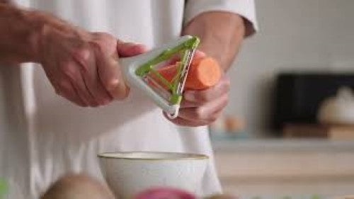 Joseph Joseph Switch 2in1 Peeler features stainless-steel blades for easy peeling and Julienne cuts in an ergonomic design.