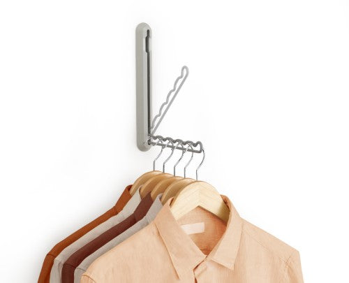 Orderly Retractable Hanging Rail by Joseph Joseph, space-saving solution for temporary clothing hanging, ideal for drying and ironing.