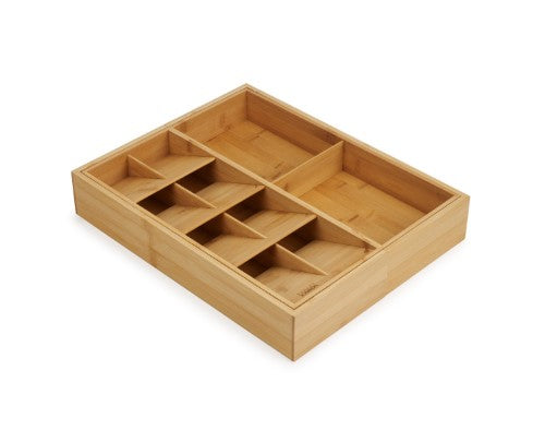 Bamboo drawer organiser with five cutlery compartments and two gadget sections for efficient kitchen storage.