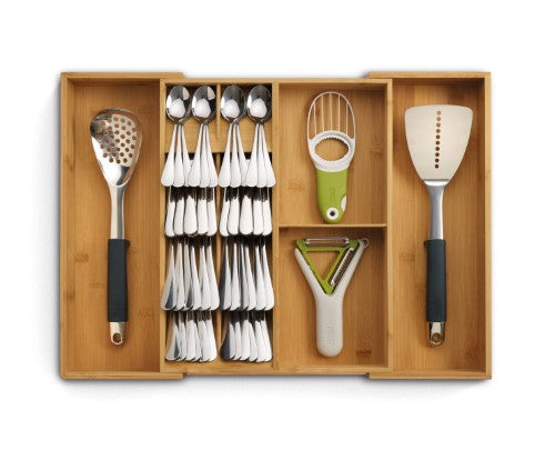 Bamboo drawer organiser with five cutlery compartments and expandable sides for efficient kitchen storage.