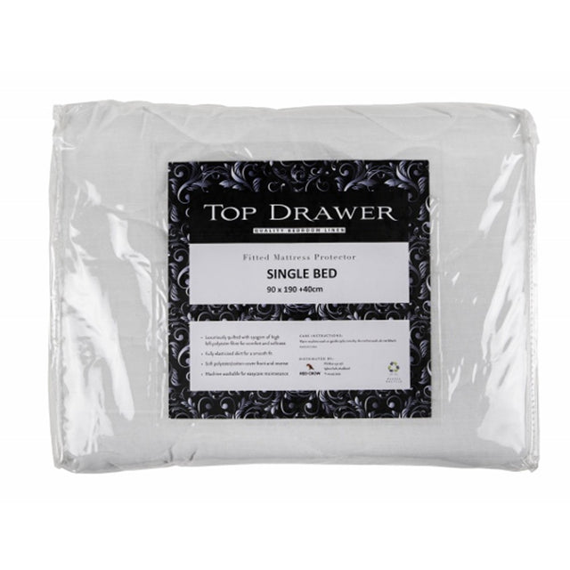 King mattress protector with quilted polyester front, offering comfort, protection, and a snug fit for optimal sleep.