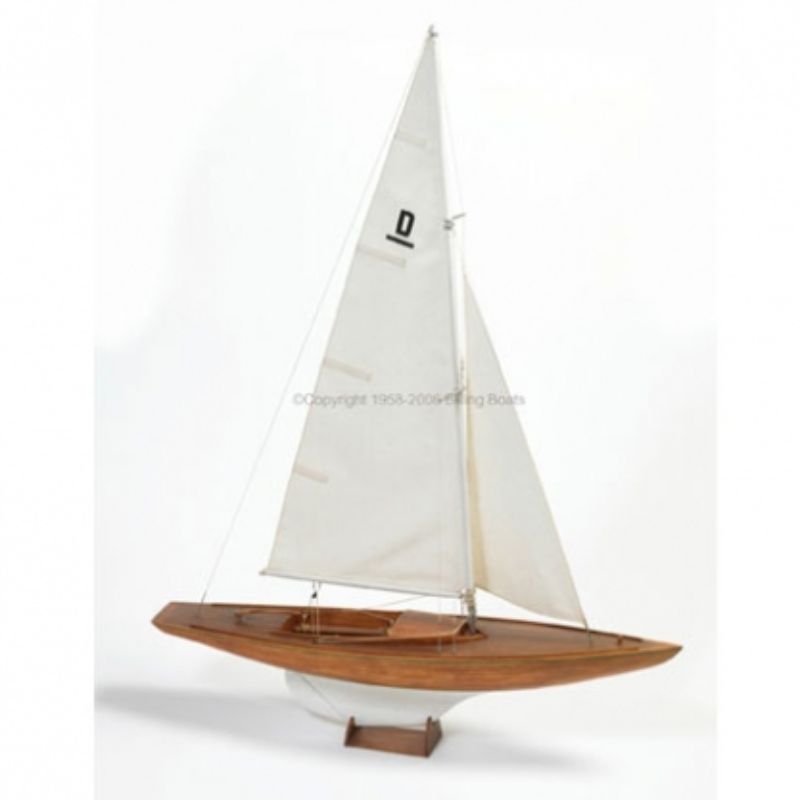 Unassembled wooden model kit of the RCC 1/12 Dragen, a historic yacht with intricate details for experienced builders.
