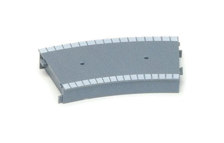 Curved plastic platform section from Hornby for seamless integration into miniature train layouts.