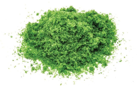 Medium green flockage for model railways, adding vibrant texture and realism to miniature landscapes.