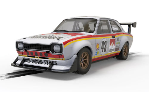 Slot car replica of Ford Escort Mk1 RSR driven by Lea Wood, featuring a detailed design and space-framed chassis for racing.