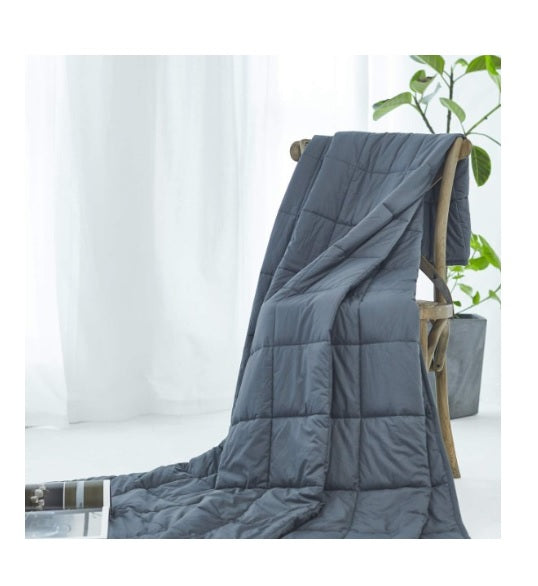 Bedmates Navy Dot Weighted Blanket Lap Pad for stress relief, measuring 48x53cm, with soft cotton and glass bead filling.