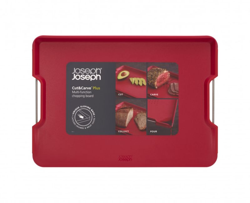Joseph Joseph Cut & Carve Plus Large Red chopping board with angled base, non-slip edges, and integrated meat grip for easy carving.