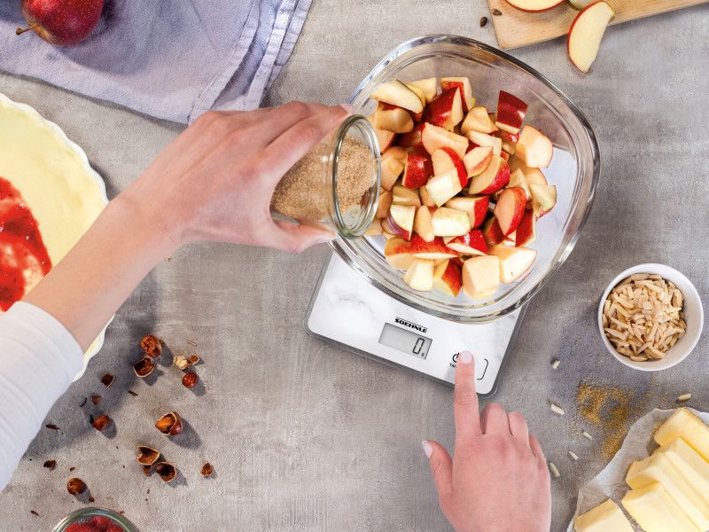 Soehnle Digital Kitchen Scale featuring a stylish marble design, 5 kg capacity, and sensor touch technology for easy measurements.