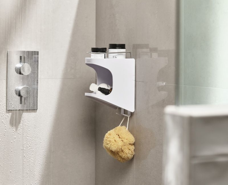 Joseph Joseph Capsule Compact 2-Tier shower shelf, slim design with self-draining top and hanging hooks for efficient storage.