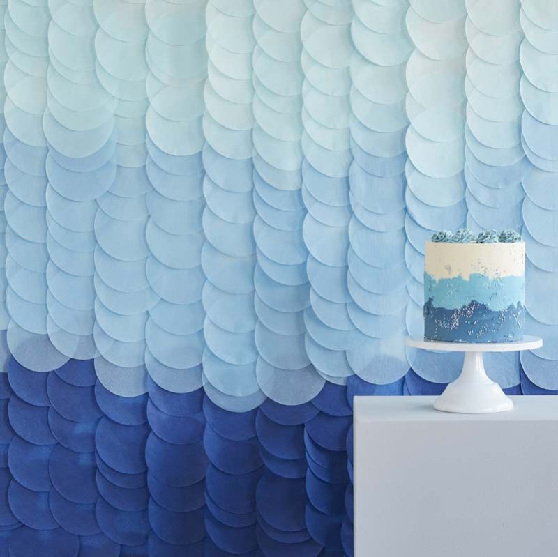 Blue ombre tissue paper disc backdrop featuring 18 strands, ideal for stylish celebrations and eco-friendly events.