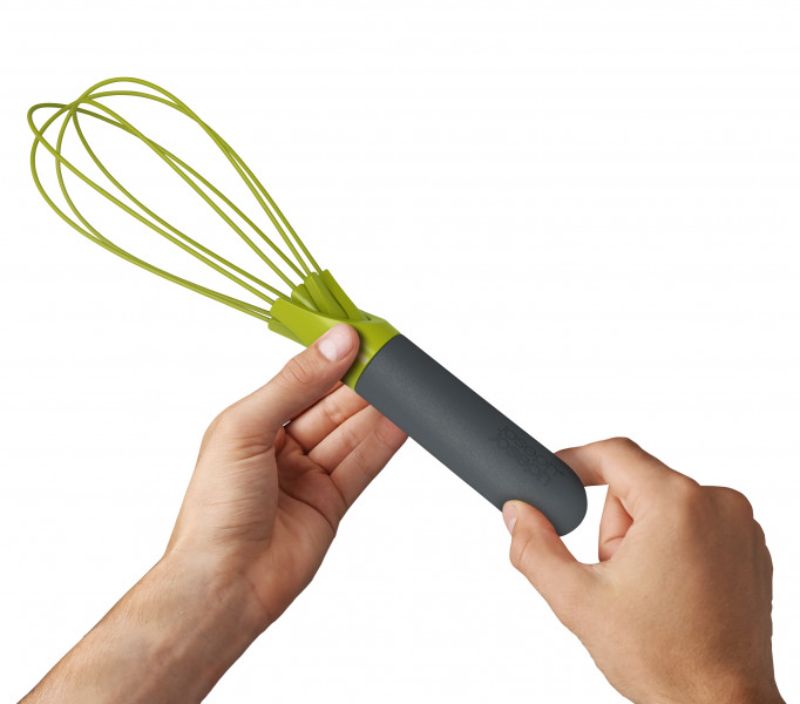 Joseph Joseph Twist Whisk in Grey/Green, featuring a unique twist mechanism for versatile cooking and baking.