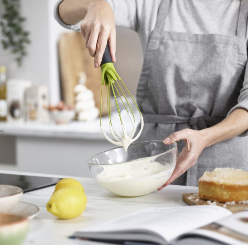 Joseph Joseph Twist Whisk in Grey/Green, featuring a unique twist design for versatile blending and whipping tasks.