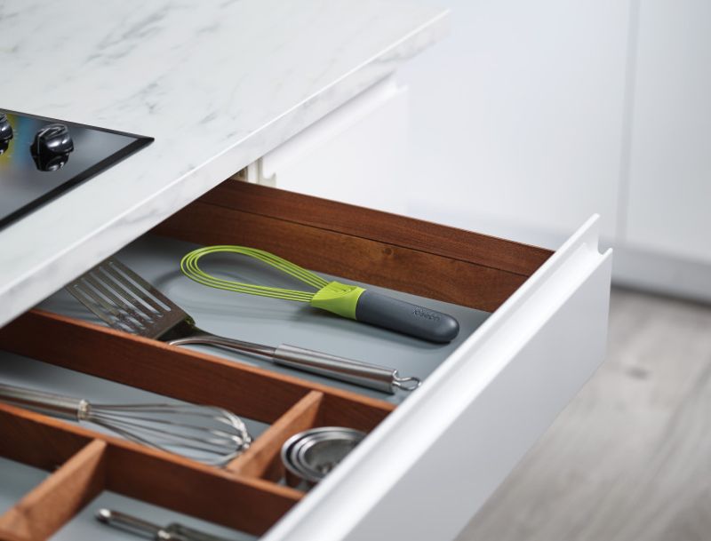 Joseph Joseph Twist Whisk in Grey/Green, a versatile tool that switches from flat to balloon whisk for all cooking needs.