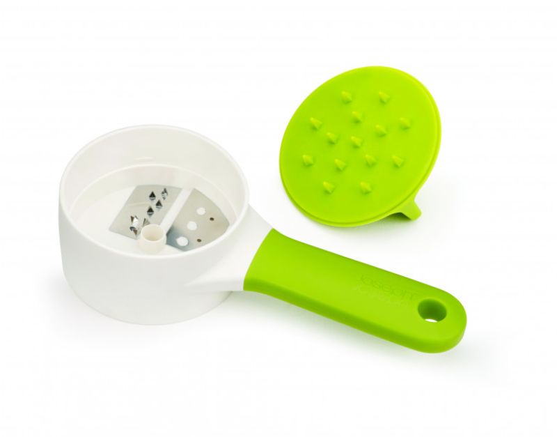 Joseph Joseph SpiroGo Compact Spiralizer in green, featuring a stainless-steel blade for easy spiralizing of vegetables.