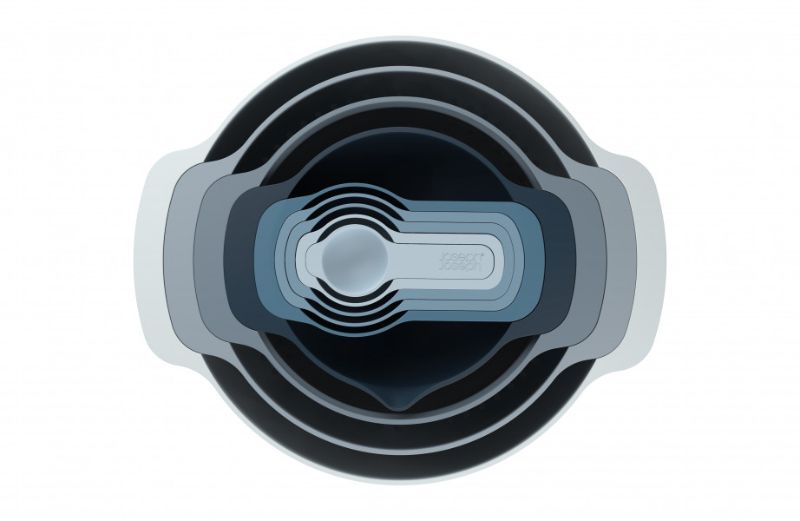 Joseph Joseph Nest 9 Plus set in sky blue, featuring nested mixing bowls, colander, sieve, and measuring cups for efficient food prep.