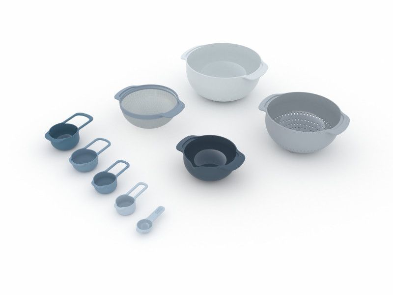 Joseph Joseph Nest 9 Plus 9-piece food prep set in sky blue, featuring nesting bowls and measuring cups for space-saving convenience.