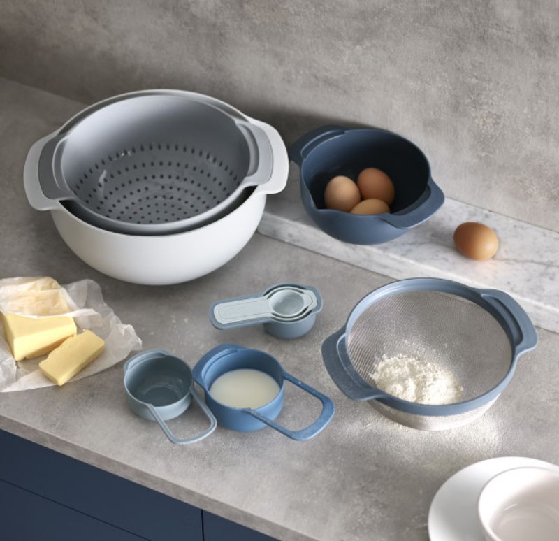 Joseph Joseph Nest 9 Plus 9-piece food prep set in sky blue, featuring nesting design and essential mixing bowls and measuring cups.